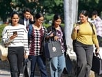 Students enjoying the sun at Panjab University, Chandigarh, on Thursday. (Keshav Singh/HT)