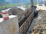 The construction of a retaining wall alongside Buddha Nullah underway in Ludhiana on Thursday. (Gurpreet Singh/HT) The construction of a retaining wall alongside Buddha Nullah underway in Ludhiana on Thursday. (Gurpreet Singh/HT)