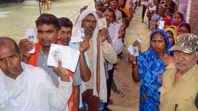 People wait for their turn to vote in Bihar. People wait for their turn to vote in Bihar.
