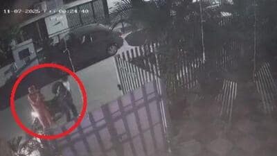 A CCTV grab of the two men, who fired over 30 rounds outside a house in Phase 7, Mohali, past Thursday midnight. (HT) A CCTV grab of the two men, who fired over 30 rounds outside a house in Phase 7, Mohali, past Thursday midnight. (HT)