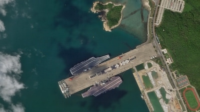 In this Oct. 8, 2025, satellite photo from Planet Labs PBC, the Chinese aircraft carriers Shandong and Fujian are seen at the Yulin Naval Base near Sanya, China. (Planet Labs PBC via AP) (AP) In this Oct. 8, 2025, satellite photo from Planet Labs PBC, the Chinese aircraft carriers Shandong and Fujian are seen at the Yulin Naval Base near Sanya, China. (Planet Labs PBC via AP) (AP)