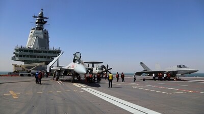 Crew members work on carrier-based aircraft from left, J-15T jet fighter, KJ-600 AWACS and J-35 stealth fighter jet on the flight deck of China's third conventionally powered aircraft carrier, the Fujian. (AP/File) Crew members work on carrier-based aircraft from left, J-15T jet fighter, KJ-600 AWACS and J-35 stealth fighter jet on the flight deck of China's third conventionally powered aircraft carrier, the Fujian. (AP/File)