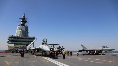 Crew members work on carrier-based aircraft from left, J-15T jet fighter, KJ-600 AWACS and J-35 stealth fighter jet on the flight deck of China's third conventionally powered aircraft carrier, the Fujian. (AP/File) Crew members work on carrier-based aircraft from left, J-15T jet fighter, KJ-600 AWACS and J-35 stealth fighter jet on the flight deck of China's third conventionally powered aircraft carrier, the Fujian. (AP/File)