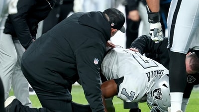 Geno Smith #7 of the Las Vegas Raiders is looked over on the field after a play against Denver Broncos (Getty Images via AFP) Geno Smith #7 of the Las Vegas Raiders is looked over on the field after a play against Denver Broncos (Getty Images via AFP)