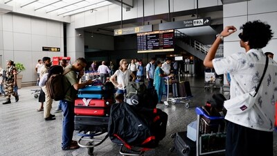 File photo of passengers waiting at Delhi's IGI airport. Officials said the technical teams are working to rectify the snag and resume smooth flight operations. (REUTERS)