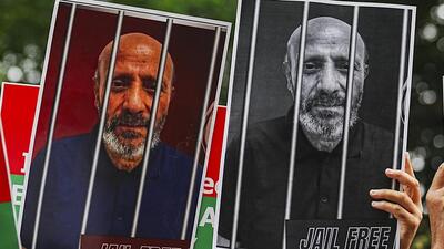Placards during a sit-in being staged by Awami Ittehad Party party workers to seek Rashid Engineer’s release from prison (PTI FILE) Placards during a sit-in being staged by Awami Ittehad Party party workers to seek Rashid Engineer’s release from prison (PTI FILE)