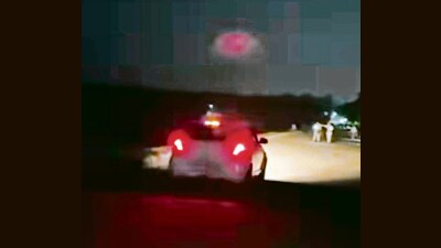 Shocked evening walkers rushed to the sides, as the car driver zipped through the track, with his wife and kids on-board. (HT Photo)