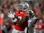 Wide receiver Carnell Tate #17 of the Ohio State Buckeyes catches a 49 yard pass for a touchdown Wide receiver Carnell Tate #17 of the Ohio State Buckeyes catches a 49 yard pass for a touchdown