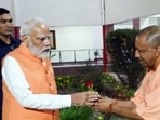Prime Minister Narendra Modi being greeted by chief minister Yogi Adityanath in Varanasi on Friday. (ANI PHOTO) Prime Minister Narendra Modi being greeted by chief minister Yogi Adityanath in Varanasi on Friday. (ANI PHOTO)