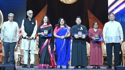 In this photo provided by the Ramon Magsaysay Awards Foundation, Ujwal Thakar, second from left, Safeena Husain, Safeena Husain, 3rd from left, and Gayatri Nair Lobo, center, from the Foundation to Educate Girls Globally based in India, receive the 67th Ramon Magsaysay Award. (AP)