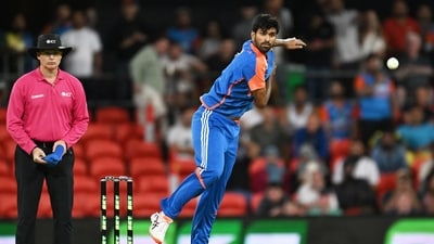 Washington Sundar bowls during a T20 cricket international between India and Australia in Carrara. (AP) Washington Sundar bowls during a T20 cricket international between India and Australia in Carrara. (AP)