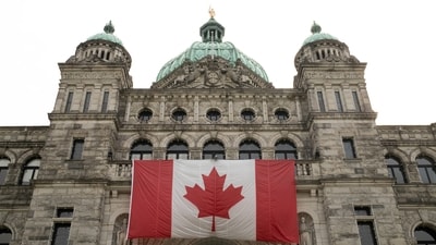 A Canadian flag adorns British Columbia's provincial legislature building in Victoria, British Columbia, Canada October 3, 2025. (Reuters)