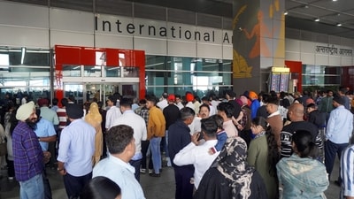 People wait outside the Indira Gandhi International (IGI) Airport, in New Delhi (PTI) People wait outside the Indira Gandhi International (IGI) Airport, in New Delhi (PTI)