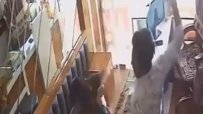 Screengrab of the CCTV footage of foiled robbery bid that surfaced on social media (X) Screengrab of the CCTV footage of foiled robbery bid that surfaced on social media (X)