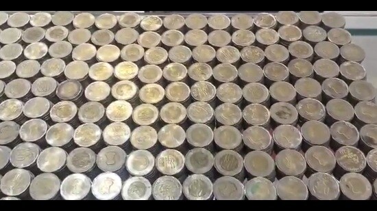 The coins that Abhishek Yadav, who runs a paan shop, saved for a year to buy a gold chain for his wife. (Sourced)