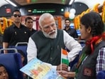 Prime Minister Narendra Modi interacts with school students at the launch of four Vande Bharat Express trains in Varanasi. (HT) Prime Minister Narendra Modi interacts with school students at the launch of four Vande Bharat Express trains in Varanasi. (HT)