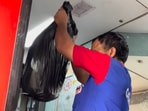 A Railways worker was seen throwing garbage from a moving train A Railways worker was seen throwing garbage from a moving train