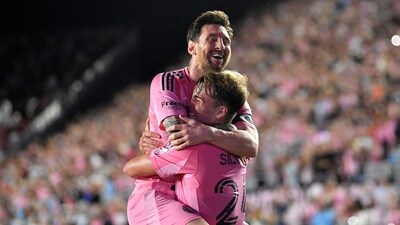 Lionel Messi, top, celebrates with Mateo Silvetti, bottom after scoring during the first half of Game 3 in the first round of MLS soccer's Western Conference playoffs against Nashville SC (AP)