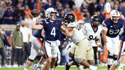Chandler Morris #4 of the Virginia Cavaliers throws a pass in the first half during a game against the Wake Forest Demon Deacons (Getty Images via AFP) Chandler Morris #4 of the Virginia Cavaliers throws a pass in the first half during a game against the Wake Forest Demon Deacons (Getty Images via AFP)
