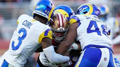 San Francisco 49ers running back Christian McCaffrey, middle, is tackled by Los Angeles Rams safety Kam Curl (3) and linebacker Omar Speights (AP) San Francisco 49ers running back Christian McCaffrey, middle, is tackled by Los Angeles Rams safety Kam Curl (3) and linebacker Omar Speights (AP)