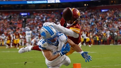 Washington Commanders cornerback Jonathan Jones breaks up a pass intended for Detroit Lions wide receiver Amon-Ra St. Brown. (IMAGN IMAGES via Reuters Connect)