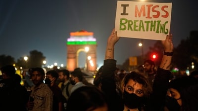 Gram it: Covered with face masks and shouting slogans, Delhiites from across age groups gathered at the India Gate and Kartavya Path to protest against the city's hazardous air quality, on Sunday evening. Here's a glimpse of how some protestors used creative posters to express their dissent over lack of clean air to breathe. (Photo: Manish Swarup/AP)