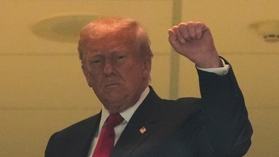 President Donald Trump, center, gestures to the crowd at the Commanders vs Detroit Lions game at Northwest Stadium. (AP) President Donald Trump, center, gestures to the crowd at the Commanders vs Detroit Lions game at Northwest Stadium. (AP)