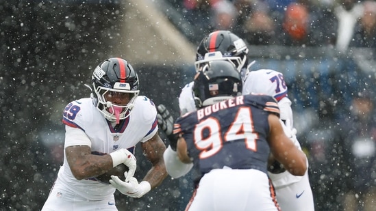 Tyrone Tracy Jr. #29 of the New York Giants carries the ball against the Chicago Bears during the first quarter in the game at Soldier Field on November 09, 2025 in Chicago, Illinois. (Getty Images via AFP)