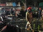 Firefighters at the spot after a blast occurred in a parked car near Red Fort, leaving multiple vehicles in flames. Firefighters at the spot after a blast occurred in a parked car near Red Fort, leaving multiple vehicles in flames.