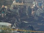 Officers from various security agencies investigate the spot after a blast occurred in a car near Red Fort, leaving multiple vehicles in flames, in New Delhi, Monday. Officers from various security agencies investigate the spot after a blast occurred in a car near Red Fort, leaving multiple vehicles in flames, in New Delhi, Monday.