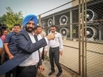 Manjinder Singh Sirsa, the environment minister of Delhi, at an air quality monitoring system at Anand Vihar in New Delhi.