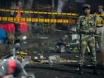 Tin containers and other items lie near the spot after a blast occurred in a parked car near Red Fort, leaving multiple vehicles in flames, in New Delhi, Monday Tin containers and other items lie near the spot after a blast occurred in a parked car near Red Fort, leaving multiple vehicles in flames, in New Delhi, Monday