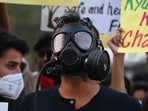 Social activists from various organizations protest against the government over rising air pollution, near India Gate, Man Singh Road, in New Delhi, India, on Sunday, November 9, 2025.  