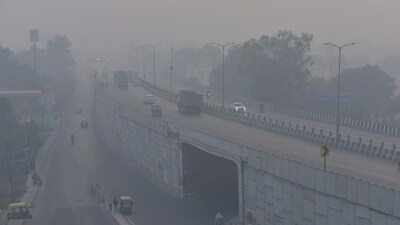 Vehicles move along National Highway 9 near Dasna amid low visibility caused by smog on Monday morning, a day after dense pollution blanketed the area, in the Delhi-NCR area.. ( Sakib Ali / Hindustan Times)