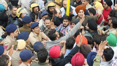 UT police using canes to disallow entry to the Panjab University campus in Chandigarh on Monday, Nov 10, 2025. (Keshav Singh/HT Photo)