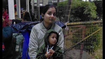A woman constable with the kids of Sogra Khatoon. (HT PHOTO) A woman constable with the kids of Sogra Khatoon. (HT PHOTO)