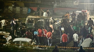 Security officers inspect the scene of a car explosion near the historic Red Fort in New Delhi, India, Monday, Nov. 10, 2025. (AP) Security officers inspect the scene of a car explosion near the historic Red Fort in New Delhi, India, Monday, Nov. 10, 2025. (AP)