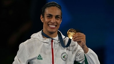 Gold medallist Algeria's Imane Khelif poses on the podium during the medal ceremony for the women's 66kg final boxing category during the Paris 2024 Olympic Games. (AFP) Gold medallist Algeria's Imane Khelif poses on the podium during the medal ceremony for the women's 66kg final boxing category during the Paris 2024 Olympic Games. (AFP)