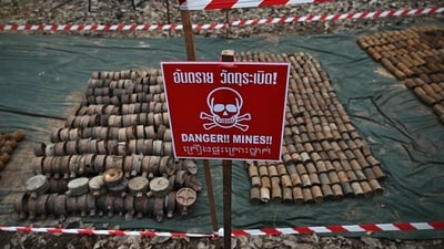 Old landmines recovered from the disputed areas following the Thai-Cambodian border conflict displayed during a press tour organized by the Royal Thai Army. (AFP File)