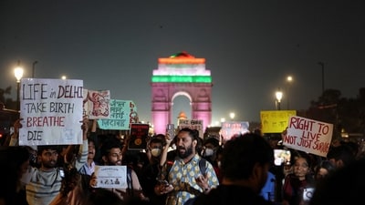 Protesters hold placards in front of the India Gate during a protest against air pollution in New Delhi, India, November 9, 2025. (REUTERS)