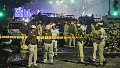 New Delhi: Police personnel at the site after a blast in a parked car near Red Fort left multiple vehicles in flames, in New Delhi, Monday, Nov. 10, 2025. (PTI Photo)(PTI11_10_2025_000424B) (PTI) New Delhi: Police personnel at the site after a blast in a parked car near Red Fort left multiple vehicles in flames, in New Delhi, Monday, Nov. 10, 2025. (PTI Photo)(PTI11_10_2025_000424B) (PTI)