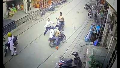 Passers-by trying to overpower the accused after they fired at a shop in Mansa town.