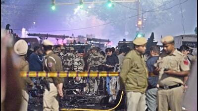 Security personnel at the spot after an explosion in a car near the Red Fort, in New Delhi on Monday. (Sanjeev Verma/HT photo) Security personnel at the spot after an explosion in a car near the Red Fort, in New Delhi on Monday. (Sanjeev Verma/HT photo)