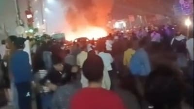 A video grab of after the explosion at Delhi's Red Fort metro station shows people gathered as fire rages in distance. (HT Photo/ Sourced) A video grab of after the explosion at Delhi's Red Fort metro station shows people gathered as fire rages in distance. (HT Photo/ Sourced)