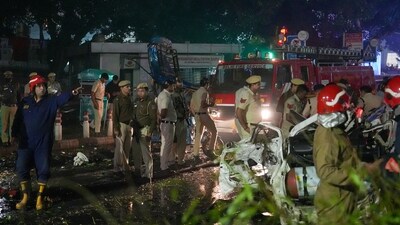 Fire services truck along with police personnel seen at the site of Delhi's Red Fort explosion (PTI) Fire services truck along with police personnel seen at the site of Delhi's Red Fort explosion (PTI)