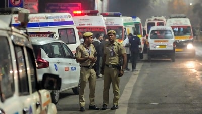 Emergency services personnel at the spot after a blast occurred in a parked car near Red Fort, leaving multiple vehicles in flames, in New Delhi. (PTI) Emergency services personnel at the spot after a blast occurred in a parked car near Red Fort, leaving multiple vehicles in flames, in New Delhi. (PTI)