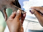 A voter gets his finger marked with with indelible ink before casting a vote at a polling station during the second and final phase of the Bihar Assembly elections, in Jehanabad.