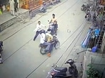 Passers-by trying to overpower the accused after they fired at a shop in Mansa town.
