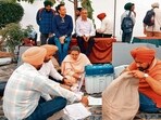 Poll teams check EVMs ahead of the Tarn Taran assembly bypoll on Monday. (HT Photo) Poll teams check EVMs ahead of the Tarn Taran assembly bypoll on Monday. (HT Photo)