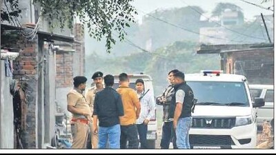 Police officers during a cordon and search operation at Fatehpur Taga village in Faridabad, on Monday. SUBHASH SHARMA/HT Police officers during a cordon and search operation at Fatehpur Taga village in Faridabad, on Monday. SUBHASH SHARMA/HT